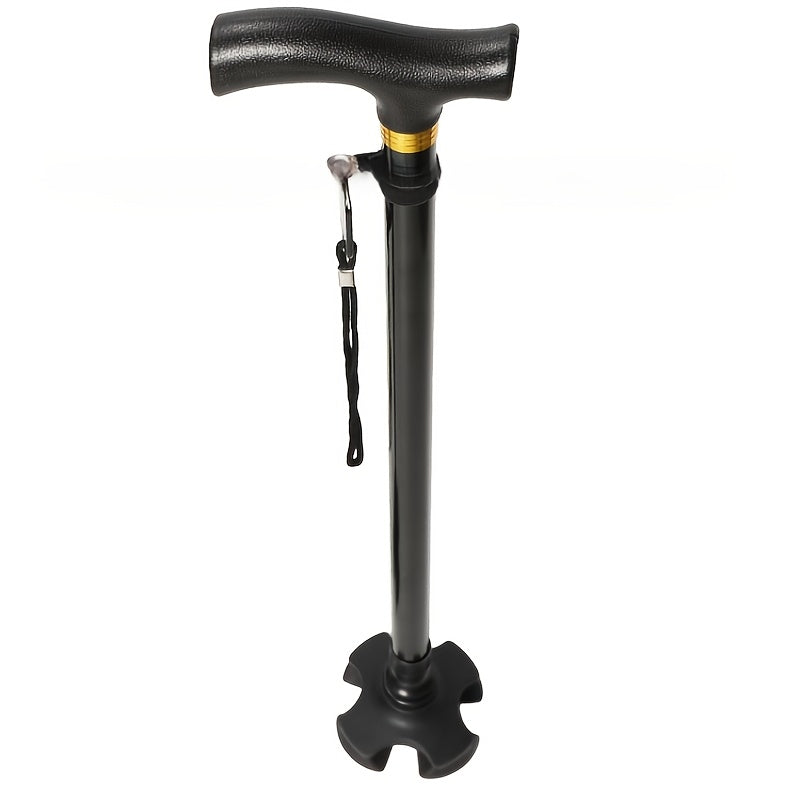 Close-up of the black T-shaped anti-slip handle, gold accent ring, wrist strap and four-point base